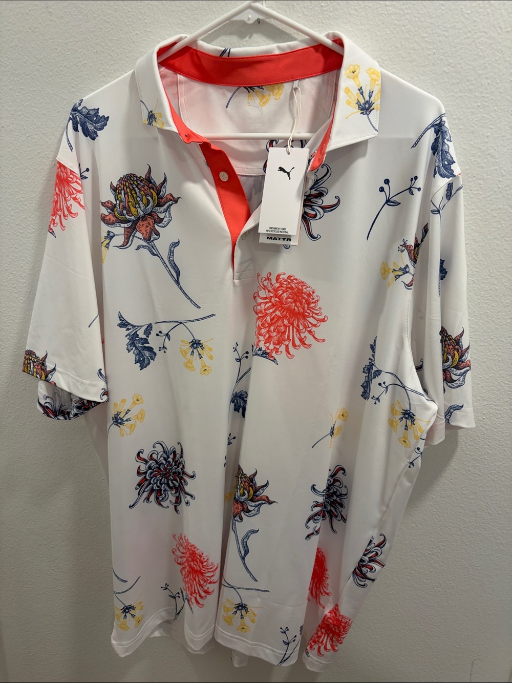 Puma Men’s White Floral Golf Polo with Red and Blue Accents